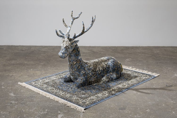 Surreal sculptures look like life-size animals covered completely in ornate carpets
